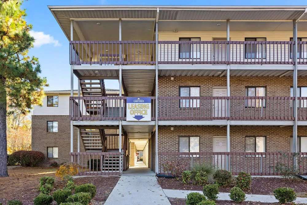 2 bedroom student apartments walking distance to ECU greenville nc property sign at The Quarterdeck